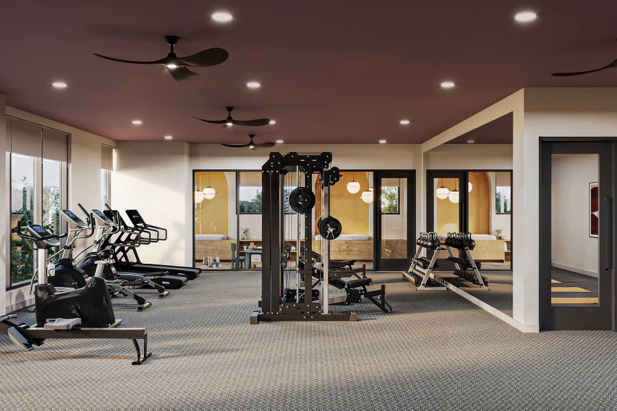 Modern gym with cardio machines, weight equipment, and a glass-enclosed yoga studio on the right at Harlow.